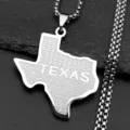 Detailed close-up of Texas state map pendant necklace with star engraving and box chain. - Silver