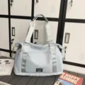 Light blue travel duffel bag, large capacity gym tote bag with durable top handles. - Light Blue