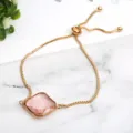 Close-up of a delicate women's slider bracelet featuring a square pink crystal pendant. - Pink