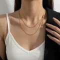 Collier ras du cou double couche doré minimaliste pour femme, élégant bijou de clavicule. - Chaîne à Perles Universelle / Perles Rondes Dorées
