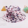 Close-up detail of the elegant organza sun hat featuring abstract print and large flower decor. - M (56-58cm) / Patterned