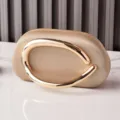 Elegant PU leather evening clutch bag featuring a chic gold metal handle for party use. - Champagne