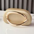 Golden PU oval evening clutch bag with unique metal ring handle for chic party fashion. - Gold
