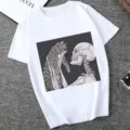 Casual white graphic t-shirt featuring a cute cat and skeleton art print for women. - XS / Tops / 21048