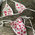 Sexy women two piece bikini swimsuit featuring cute red cherry print and adjustable tie straps. - S / White