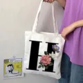 Borsa shopper in tela con lettera H e stampa floreale, comoda borsa a tracolla casual. - Lettera H / 15x13