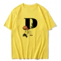 Women casual yellow short sleeve t-shirt featuring a stylish black letter P and vintage floral print. - S / Tops / Letter P
