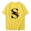 Yellow short sleeve t-shirt with large black letter S and vintage floral print detail. - S / Tops / Letter S
