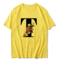Yellow short sleeve t-shirt featuring a vintage floral letter T graphic print design. - S / Tops / Letter T