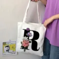 Borsa shopper in tela con lettera R e stampa floreale, grande borsa a spalla casual. - Lettera R / 15x13