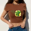 Brown crop t-shirt detail featuring St. Patrick's Day clover hat print design view. - S / Brown