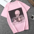 Pink graphic women t-shirt featuring skeleton and cat drinking coffee print, casual short sleeve top - Pink (21061)