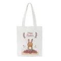 Close-up detail van witte canvas tas met schattige paashaas graphic print en tekst. - 22727