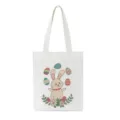 Gedetailleerd close-upoverzicht van de paashaas grafische print op de witte canvas tas. - 22728