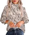 Detailed view of the elegant mock neck long sleeve blouse with black abstract dot print. - Apricot 2