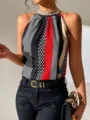 Nahaufnahme des eleganten Neckholder-Tops mit auffälligem Polka-Dot- und Streifenmuster. - S / Grün