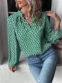 Schicke grüne Bluse mit abstraktem Print, V-Ausschnitt und modischen Ballonärmeln. - S / Oberteile / Grün
