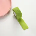 Green self-adhesive finger bandage tape for writing protection and anti-callus support. - Green