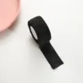 Black cohesive finger bandage elastic tape for writing protection and anti-callus care single roll. - Black