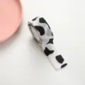 Cute cow print self-adhesive finger tape for writing protection and anti-callus care. - Cow