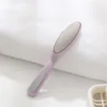 Dual-sided foot file and callus remover with stainless steel surface for smooth heels. - Nordic Purple