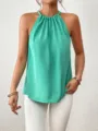 Close-up detail of women's sleeveless halter neck top in mint green, stylish and elegant. - S / Teal