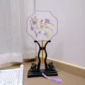 Chinese embroidered round fan detail, elegant floral pattern with purple tassel and wood stand. - 22