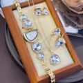 Exquisite 4-piece irregular crystal jewelry set featuring matching watch, necklace, earrings. - White