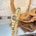 Elegant gold small dial quartz watch with slim metal link strap for women daily wear. - Black Dial / Gold