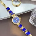 Elegante Damen Quarzuhr in Gold mit blauen Schmetterling Kristall Armband und Zifferblatt. - Blau