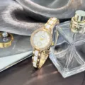 Elegante Damen Quarzuhr mit weißem Keramikarmband Kristall Lünette und klassischem Zifferblatt. - Gold
