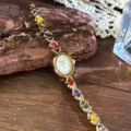 Vintage rainbow gemstone quartz watch with elegant oval dial and sparkling colorful crystal bracelet. - White Dial