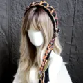 Fascia per capelli fatta a mano all'uncinetto, cerchietto con nappe stile vintage. - Marrone scuro
