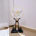 Traditional Chinese embroidered round fan with wooden stand and elegant tassel decor. - 10