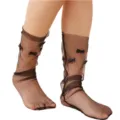 Detailed view of sheer black Lolita mesh socks with cute bow decorations for summer style. - One Size / Black
