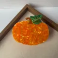 Close-up detail shot of cute pumpkin hair claw clip, creative cartoon hair accessory. - Large Pumpkin