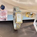 Elegante Vintage rechteckige Quarzuhr für Damen mit einzigartigem zweifarbigen Metallarmband. - Zweifarbig (Gold & Silber)