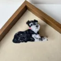 Detailed close-up of a cute black and white schnauzer acetate hair claw clip accessory. - Schnauzer