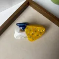 Detail view of stylish acetate rhinestone mushroom hair claw clip elegant fashion hair accessory - Yellow Mushroom