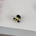 Mini black hair claw clip with a cute yellow bow design, detail view showing fine craft. - Black Claw - Yellow Bowknot