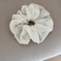 Detail shot of chic beige gingham chiffon hair scrunchie with vintage pleated texture. - Beige Plaid Scrunchie