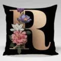Close-up detail of the black square pillow cover featuring a gold letter R and flowers. - Single-Sided Peach Skin Pillowcase; Inner Not Included; 45x45cm