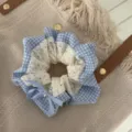 Detailed view of a blue and white checkered lace scrunchie with a cute bow and pearl detail. - Scrunchie Blue Plaid Style / Blue