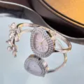 Elegant clover teardrop bangle quartz watch for women, luxury silver rhinestone wristwatch detail. - Silver