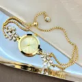 Elegant women quartz bracelet watch with sparkling crystal flower charms and adjustable slider chain. - Gold
