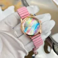 Rosa elastisches Band Quarzuhr für Damen mit buntem Regenbogen Zifferblatt Roségold. - Rosa