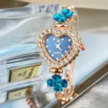 Heart dial quartz watch with blue crystal clovers and sparkling rhinestones for women stylish wrist. - Teal