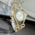 Damen Luxus Quarzuhr Gold Metall Armreif Armband Strass Zifferblatt Mode elegante Uhr - Weiß
