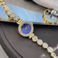 Close-up detail of a delicate rhinestone chain quartz watch with a stunning blue dial. - Sapphire Blue
