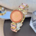 Elegante dames quartz horloge armband met kleurrijke kristallen band en ronde wijzerplaat. - Oranjeroze